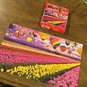 500 piece puzzle.Sunset balloons over tulip field